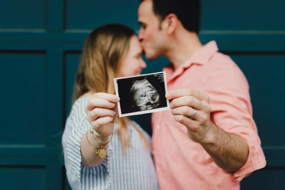 Couple with ultrasound picture of their baby